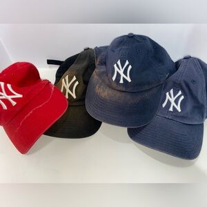 Lot of 4 distressed New York Yankees hat lot